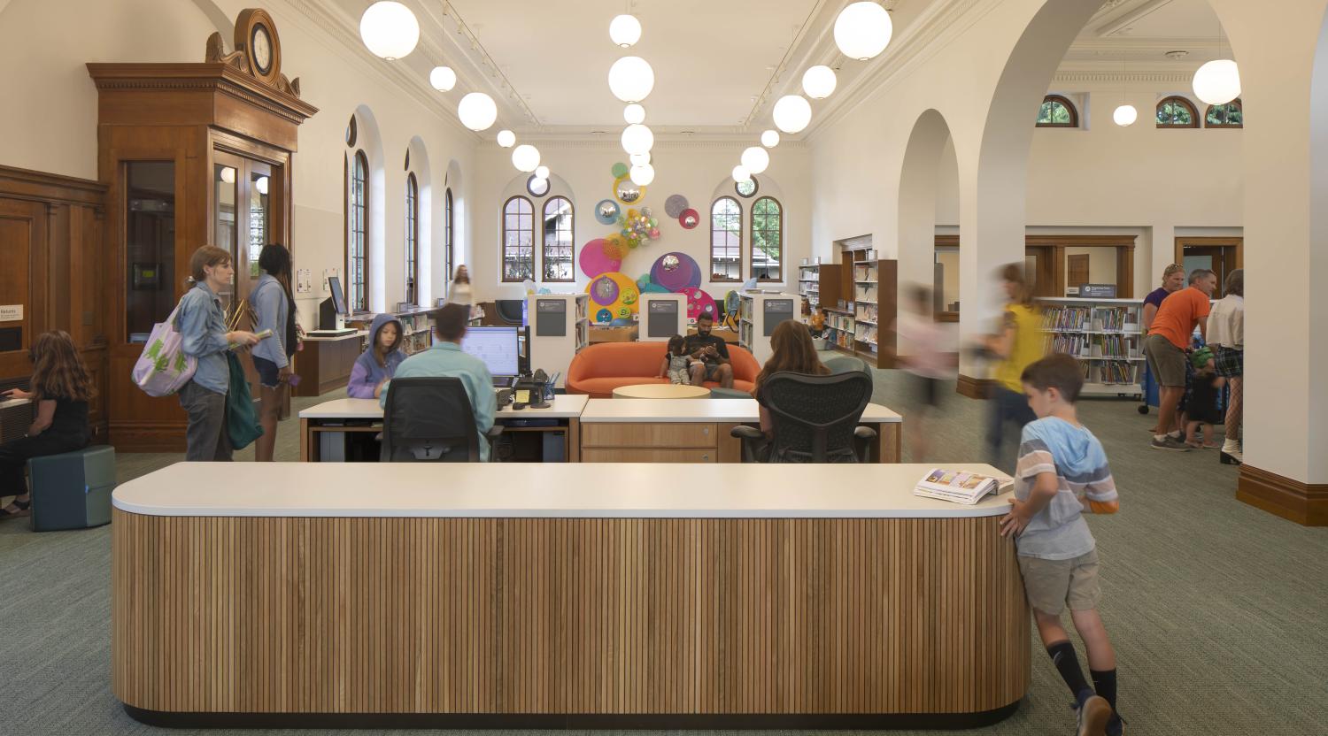 Albina Library historic interior with a circulation desk and children's area in Portland, OR