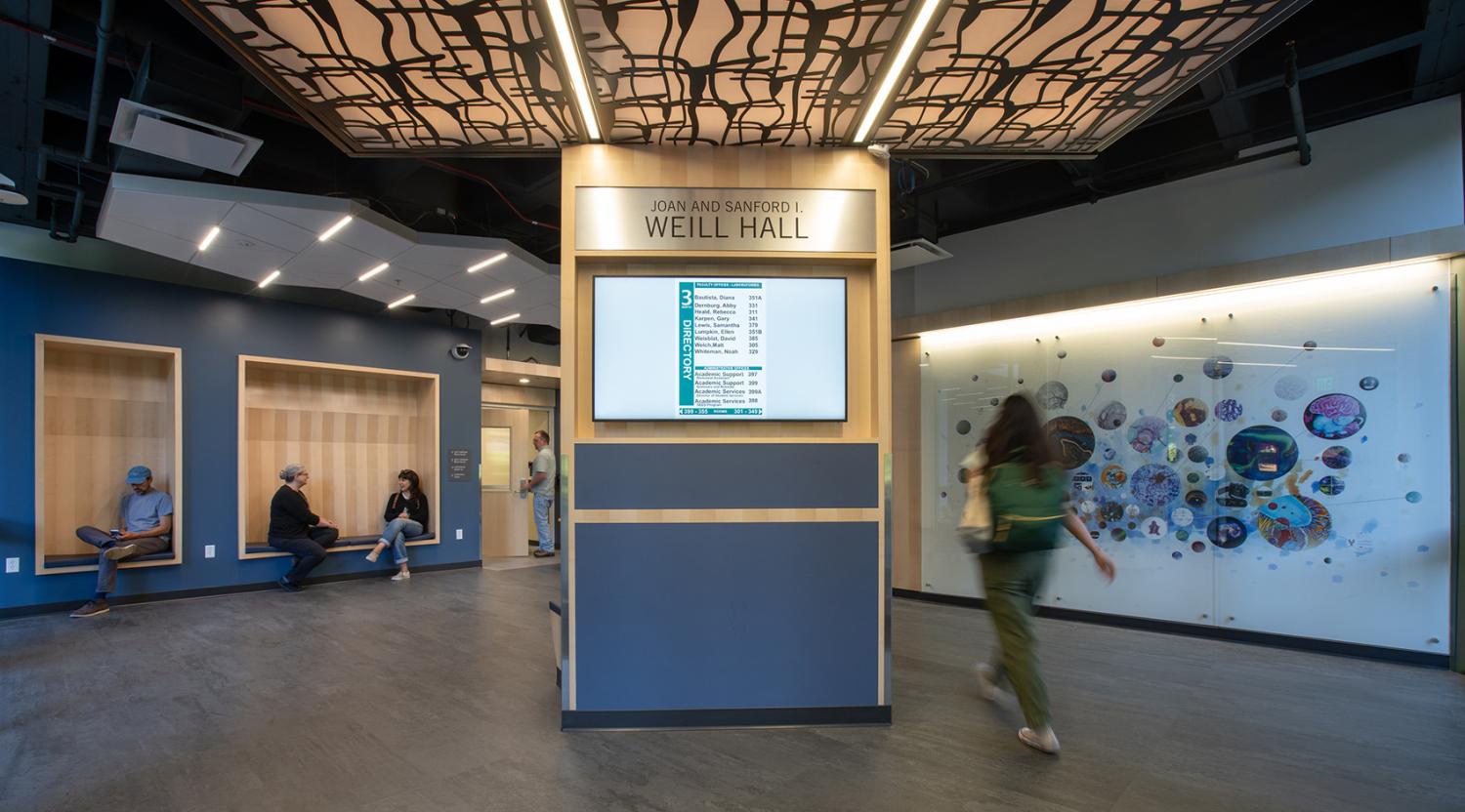 Interior lobby at UC Berkeley Weill NeuroHub East with upgraded finishes, lighting, wayfinding, and gathering space for connection.