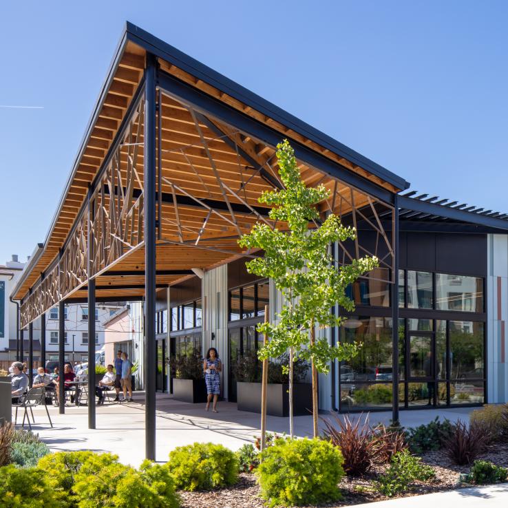 Age Well Center at South Fremont exterior view of main entry and outdoor seating area