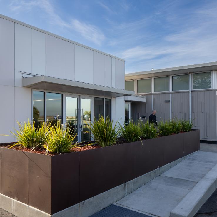 Operations facility exterior main entry and landscaped perimeter
