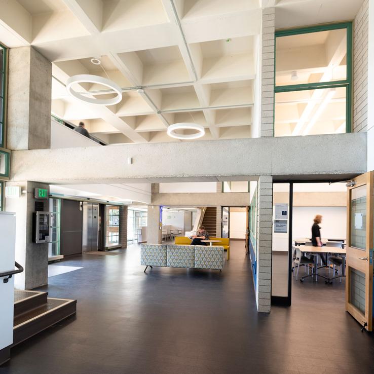 Modernized lobby with mezzanine connections and exposed concrete