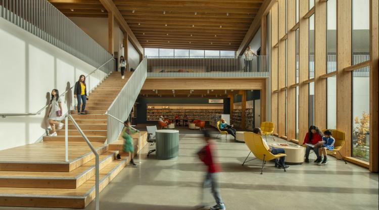 Albina Library interior featuring a 2-story community room with floor to ceiling windows in Portland, OR